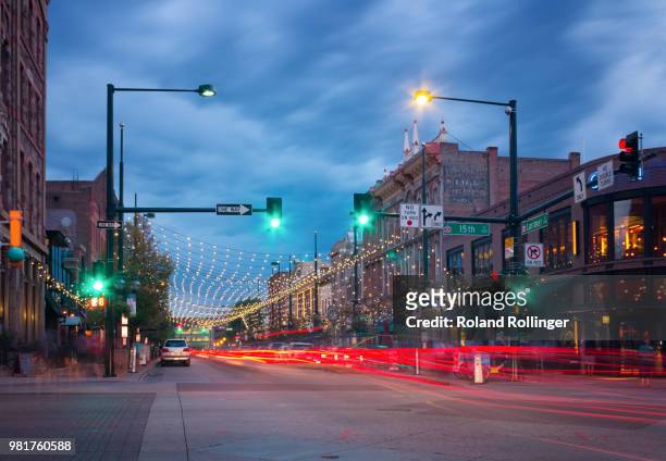 city street at night, denver, colorado, usa - denver street stock pictures, royalty-free photos & images