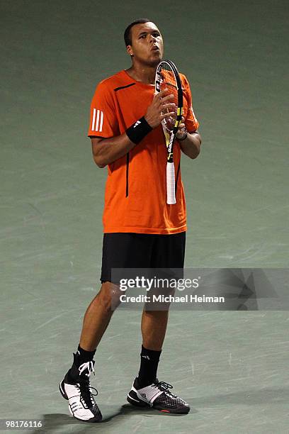 Jo-Wilfried Tsonga of France reacts against Rafael Nadal of Spain during day nine of the 2010 Sony Ericsson Open at Crandon Park Tennis Center on...
