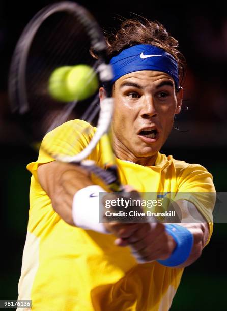 Rafael Nadal of Spain returns a shot against Jo-Wilfried Tsonga of France during day nine of the 2010 Sony Ericsson Open at Crandon Park Tennis...