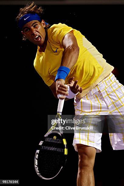 Rafael Nadal of Spain serves against Jo-Wilfried Tsonga of France during day nine of the 2010 Sony Ericsson Open at Crandon Park Tennis Center on...