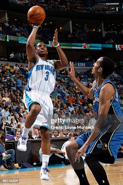 Chris Paul of the New Orleans Hornets shoots over Shaun Livingston of the Washington Wizards on March 31, 2010 at the New Orleans Arena in New...
