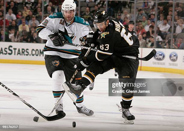 Mike Ribeiro of the Dallas Stars battles for the loose puck against Patrick Marleau of the San Jose Sharks on March 31, 2010 at the American Airlines...