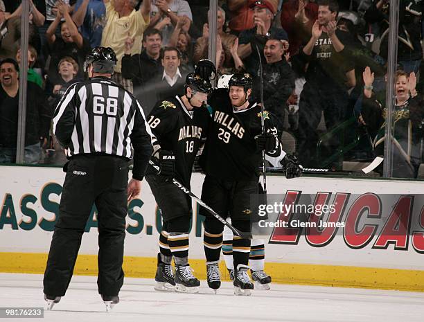 Steve Ott and James Neal of the Dallas Stars celebrate Ott's hat trick against the San Jose Sharks on March 31, 2010 at the American Airlines Center...