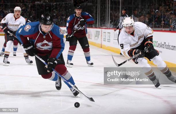 John-Michael Liles of the Colorado Avalanche skates against Bobby Ryan of the Anaheim Ducks at the Pepsi Center on March 31, 2010 in Denver, Colorado.