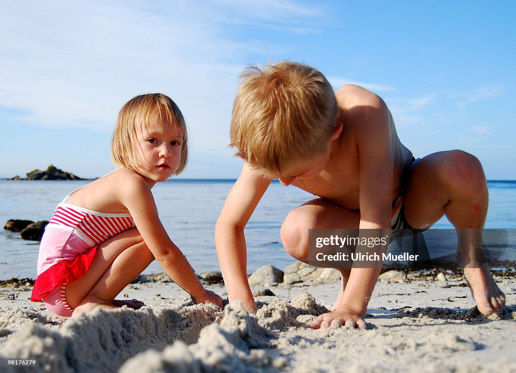 Childern playing on sand