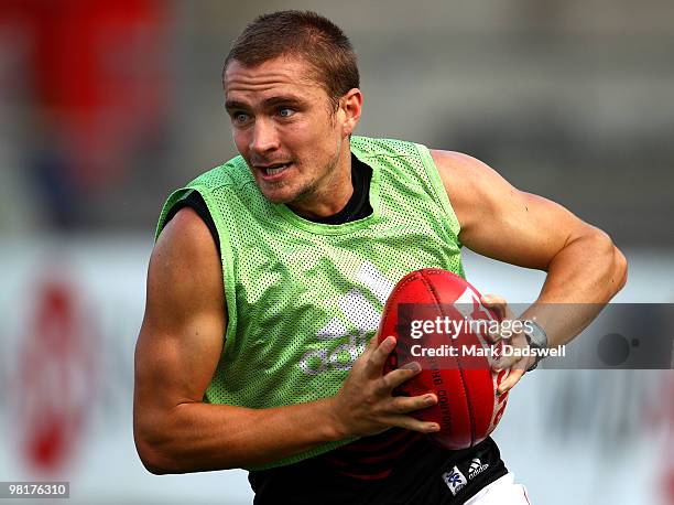 Ricky Dyson of the Bombers gathers the ball during an Essendon Bombers AFL training session at Windy Hill on April 1, 2010 in Melbourne, Australia.