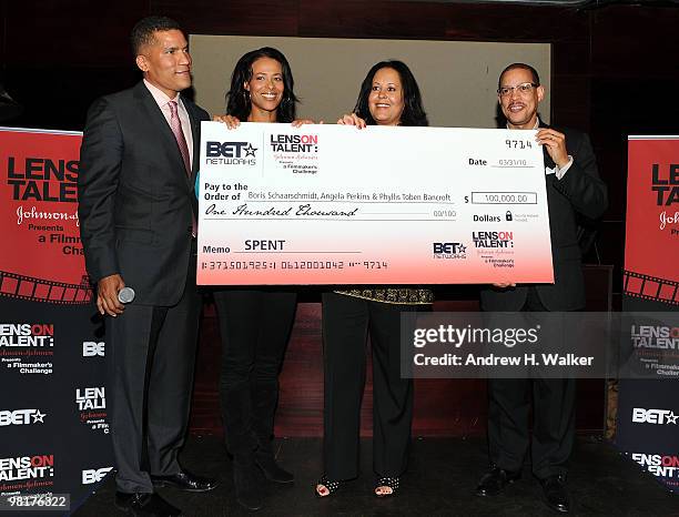 S Paxton Baker, Tracey Costello, Phyllis Toben Bancroft and Johnson & Johnson's Anthony Carter hold the grand prize check presented for the movie...