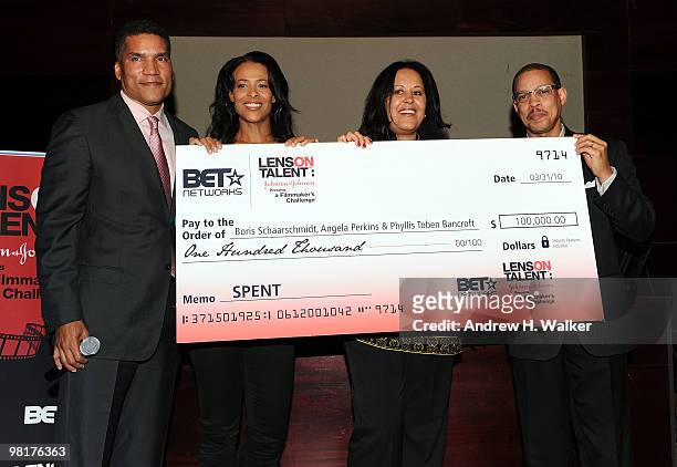 S Paxton Baker, Tracey Costello, Phyllis Toben Bancroft and Johnson & Johnson's Anthony Carter hold the grand prize check presented for the movie...