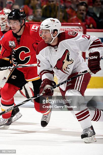 Lee Stempniak of the Phoenix Coyotes skates against David Moss of the Calgary Flames on March 31, 2010 at Pengrowth Saddledome in Calgary, Alberta,...
