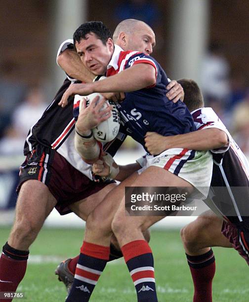 Adrian Morley of the Sydney Roosters is tackled by Josh Stuart of the Northern Eagles during Round Five of the National Rugby League played at the...