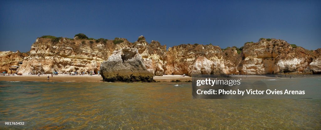 Wide angle view of Alvor beach as seen from the sea in Portimao, Algarve, Portugal