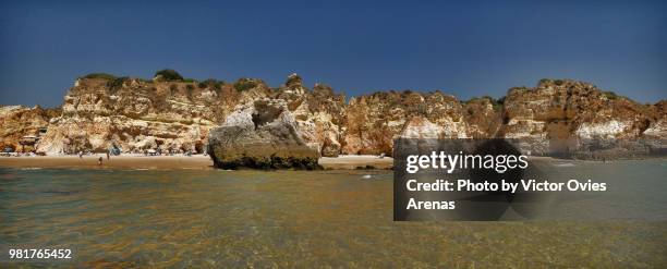 wide angle view of alvor beach as seen from the sea in portimao, algarve, portugal - alvor stock pictures, royalty-free photos & images