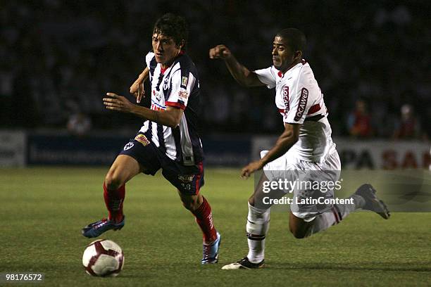Neri Cardozo of Mexico's Monterrey fights for the ball with Junior Cesar of Brazil's Sao Paulo FC during a 2010 Libertadores Cup soccer match between...