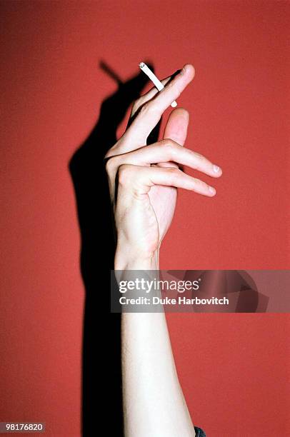 hand and cigarette - cigarette stock pictures, royalty-free photos & images