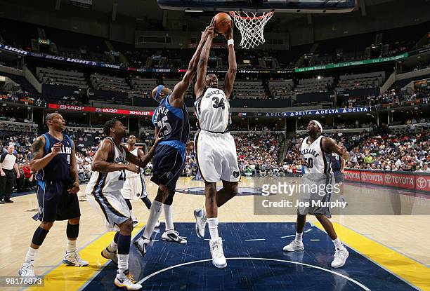 Hasheem Thabeet of the Memphis Grizzlies rebounds against Eric Dampier of the Dallas Mavericks on March 31, 2010 at FedExForum in Memphis, Tennessee....