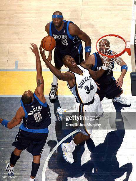 Hasheem Thabeet of the Memphis Grizzlies rebounds against Eric Dampier, Shawn Marion, and Jason Kidd of the Dallas Mavericks on March 31, 2010 at...