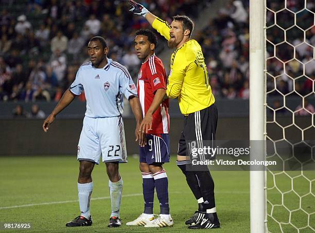 Goalkkeeper Matt Pickens and Marvell Wynne of the Colorado Rapids set up to defend a corner kick as Maykel Galindo of Chivas USA takes his place in...