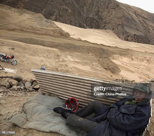 Worker rests at an iron ore mine on March 31, 2010 in Xinghe County of Ulanqab, Inner Mongolia Autonomous Region, China. According to state media,...