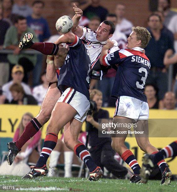 Wayne Evans of the Northern Eagles is tackled by Ryan Cross of the Sydney Roosters during Round Five of the National Rugby League played at the...