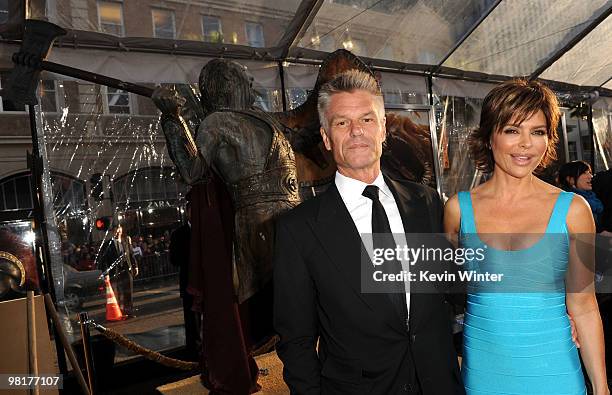 Actor Harry Hamlin and TV personality Lisa Rinna arrives to the premiere of Warner Bros. "Clash Of The Titans" held at Grauman's Chinese Theatre on...