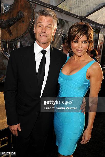 Actor Harry Hamlin and TV personality Lisa Rinna arrives to the premiere of Warner Bros. "Clash Of The Titans" held at Grauman's Chinese Theatre on...