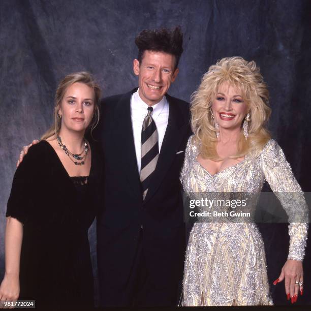 Country singer and songwriter Mary Chapin Carpenter, Lyle Lovett, and Dolly Parton backstage before the CMA Award Show Backstage October 10, 1988 in...