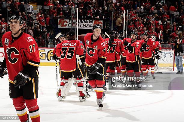 Jay Bouwmeester, Rene Bourque and teammates of the Calgary Flames celebrate a victory against the Phoenix Coyotes on March 31, 2010 at Pengrowth...