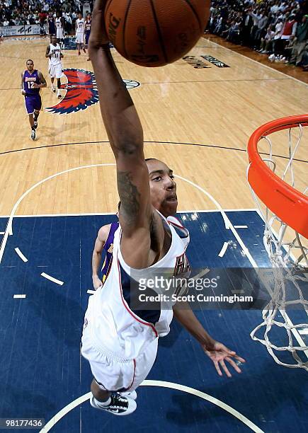 Jeff Teague of the Atlanta Hawks dunks against the Los Angeles Lakers on March 31, 2010 at Philips Arena in Atlanta, Georgia. NOTE TO USER: User...