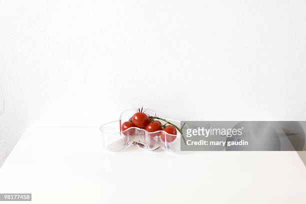 tomatoes in alvar aalto bowl. - alvar aalto stock pictures, royalty-free photos & images