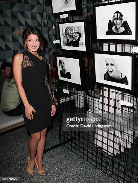 Actress/photographer Shenae Grimes poses with her photographs at the St. Jude's Children's Research Hospital benefit hosted by her at the Avalon...
