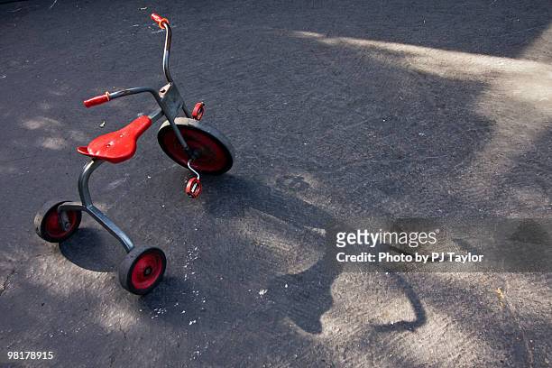 playground tricycle - tricycle stock pictures, royalty-free photos & images