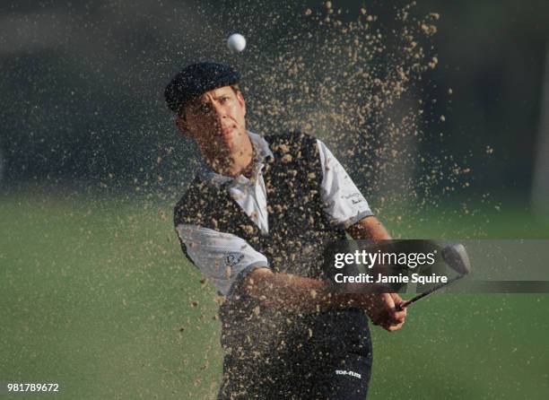 Payne Stewart of the United States keeps his eye on the ball as he hits out of the bunker during the Mercedes Championships golf tournament on 6...