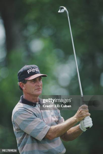 Bruce Summerhays of the United States follows his iron shot during the Ford Senior Players Championship on 13 July 1996 at the TPC of Michigan,...