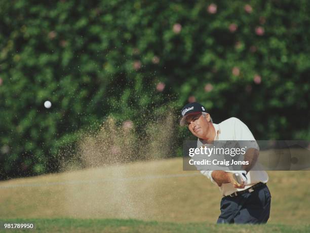 Curtis Strange of the United States hits out of the sand from a bunker during the United Airlines Hawaiian Open golf tournament on 14 February 1998...