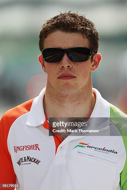 Paul Di Resta of Great Britain and Force India walks in the paddock during previews to the Malaysian Formula One Grand Prix at the Sepang Circuit on...