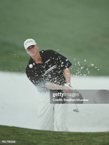 Steve Stricker of the United States keeps his eye on the ball as he chips out of the sand bunker on 5 April 2001 during the US Masters Golf...