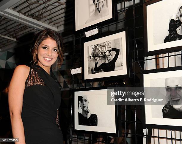 Actress Shenae Grimes poses with her photographs at a benefit for St. Jude Children's Hospital hosted by actress Shenae Grimes on March 31, 2010 in...