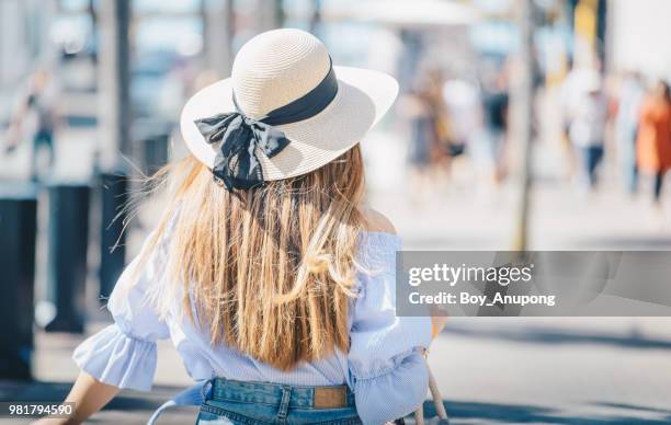 back vier of young women travelling in napier town of new zealand. - napier street stock pictures, royalty-free photos & images