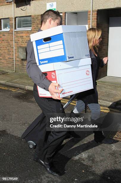 Heather Mills assistant carries boxes of evidence into her employment tribunal held at Ashford Employment Tribunal Centre on April 1, 2010 in...