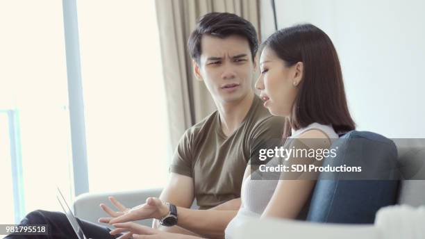 upset husband argues with wife - asian wife stock pictures, royalty-free photos & images