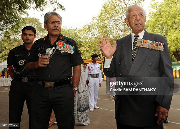 Indian soldiers stand guard as unseen Major General S.K. Jha , General Officer Commanding Golden Katar Division, stands with Colonel Madanlal, the...