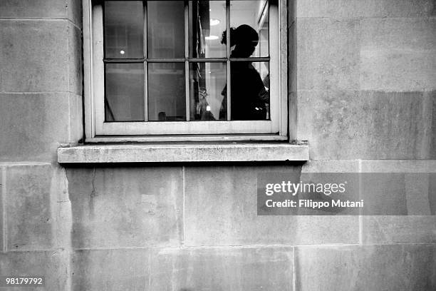 Girl looking through the window of the Royal Academy of Drama,on January 9, 2009 in London, England.