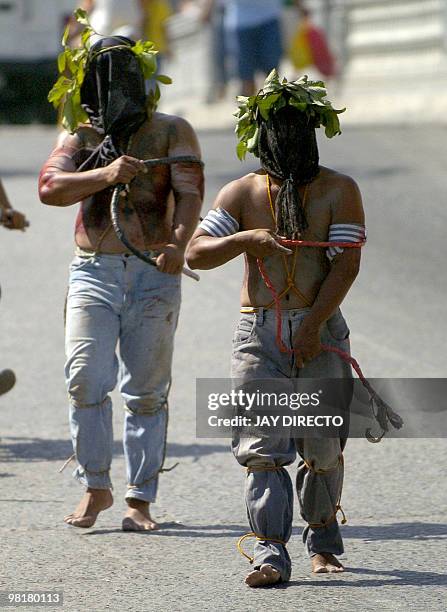 Penitents in the city of San Fernando, Pampanga in the Roman Catholic Philippines, take part in the annual Maundy Thursday, the eve of Jesus Christ's...