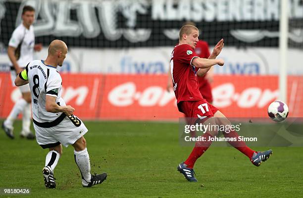 Sven Kresin of Burghausen in action with Richard Weil of Heidenheim during the third division match between Wacker Burghausen and 1. FC Heidenheim at...