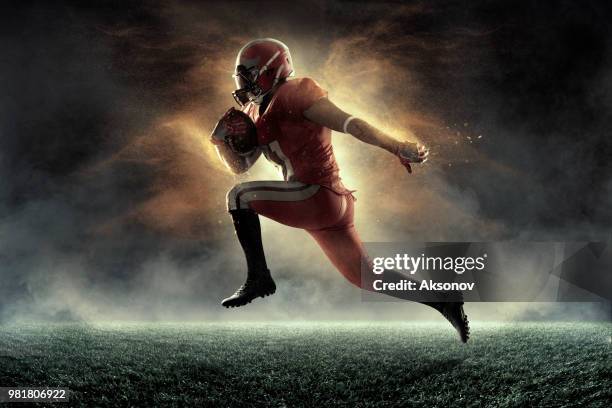 american football player in professional sport stadium - american football strip stock pictures, royalty-free photos & images