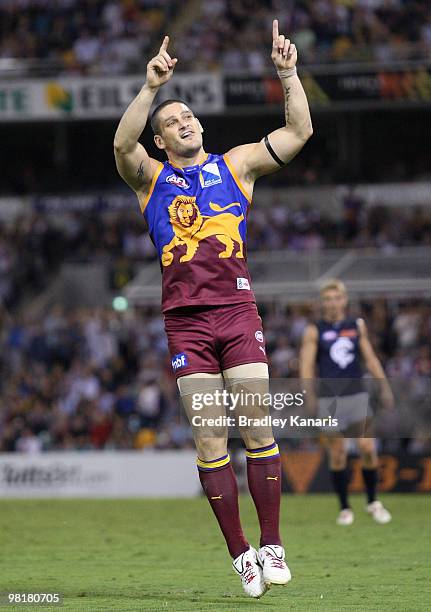 Brendan Fevola of the Lions celebrates scoring a goal during the round two AFL match between the Brisbane Lions and the Carlton Blues at The Gabba on...