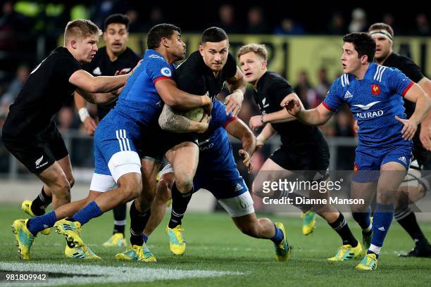 Sonny Bill Williams of the All Blacks is tackled during the International Test match between the New Zealand All Blacks and France at Forsyth Barr...