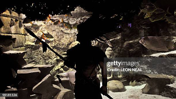 Ernesto Marinhos, a native of Charala, an isolated village in Colombia, performs a unique tribal call during a 'Spring Time blessing' on the aquatic...