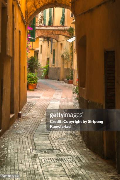 alley in albenga, savona, italy. - copyright by siripong kaewla iad stock pictures, royalty-free photos & images