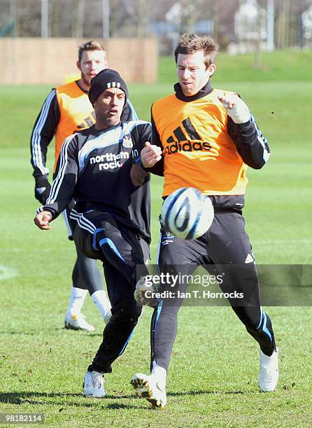 Wayne Routledge is challenged by Mike Williamson during a Newcastle United training session at the Little Benton training ground on April 01, 2010 in...